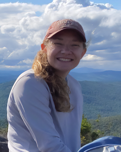 Ashley Pratt with mountains in the background