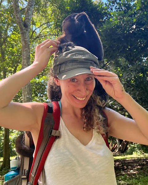 Leah Greenspan in Peru with a monkey on her head